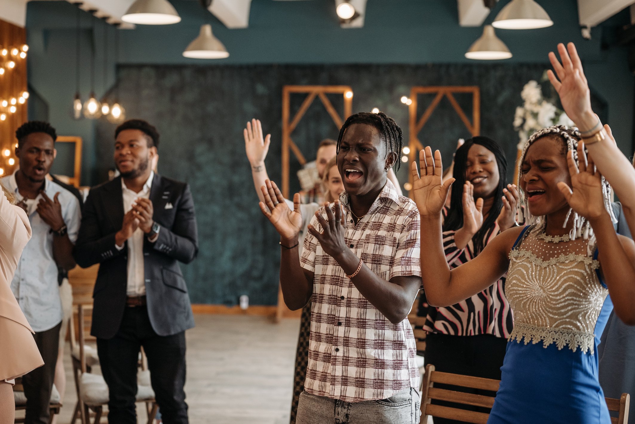 Group of People Standing and Praising